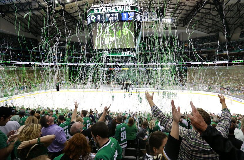 Streamers fall from the rafters as Dallas Stars fans celebrate their team's 2-1 victory over...