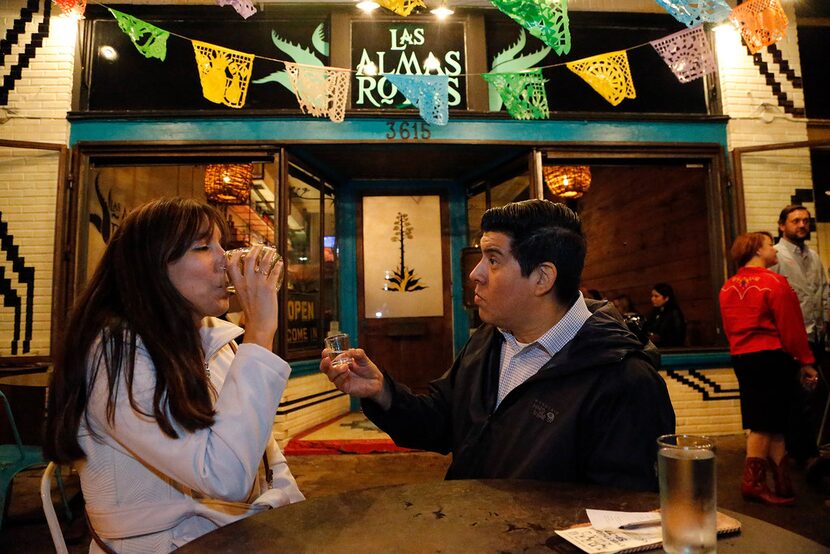 Dallas residents Rosa Guerrero  and Mark Benavidez try the brisket mezcal created in...