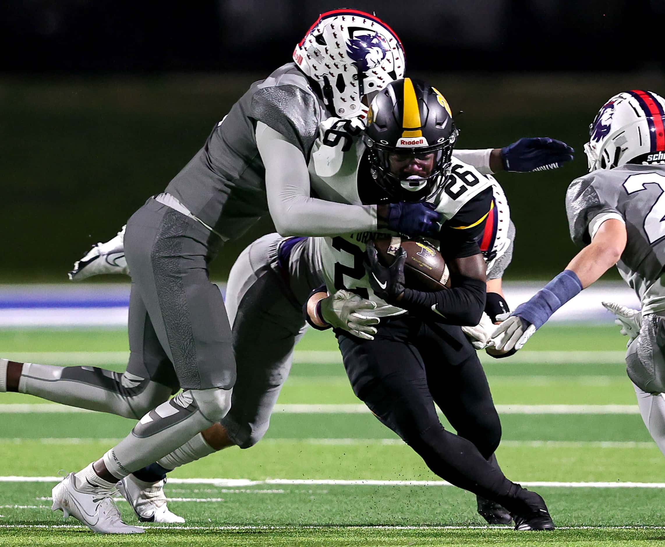 Forney running back Javian Osborne (26) fights for yardage against Richland during the first...