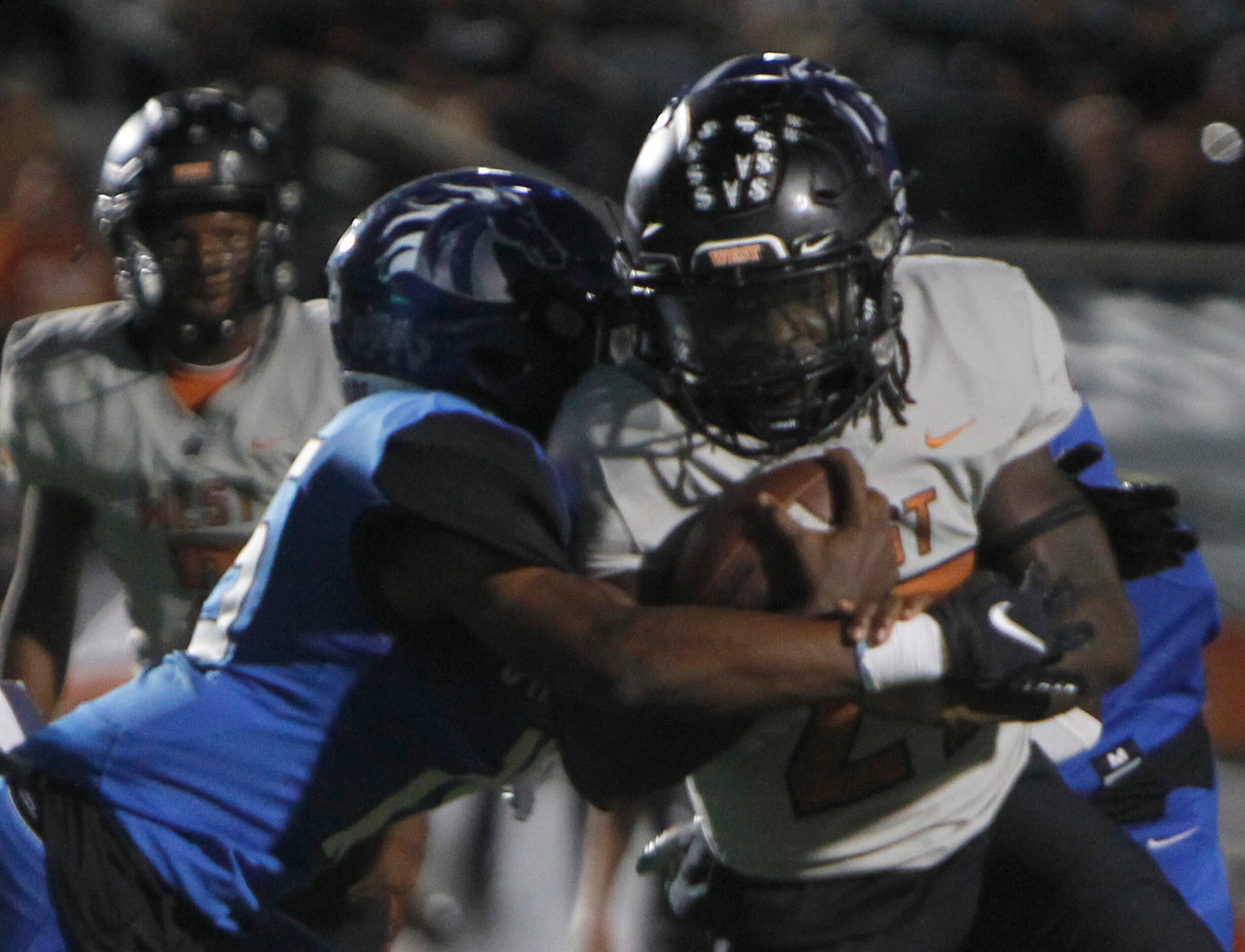 West Mesquite running back Da'Juan Limbrick (27), right, scores a rushing touchdown as North...