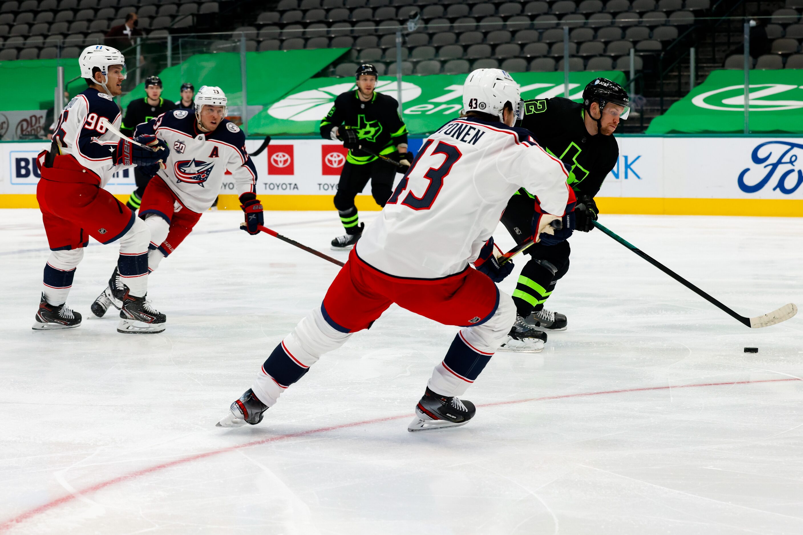 Dallas Stars center Radek Faksa (12) heads for the goal as the Columbus Blue Jackets follow...