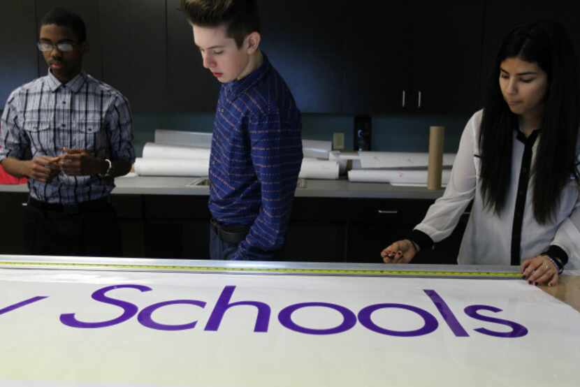 Dubiski Career High School students (from left) Rayford Starr II, 15, Stephen Bronder, 16,...