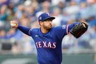 Texas Rangers pitcher Dane Dunning delivers to a Kansas City Royals batter during the first...