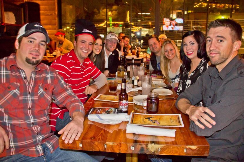 A group of friends hang out at The Nodding Donkey on SMU Boulevard in Dallas in 2012.
