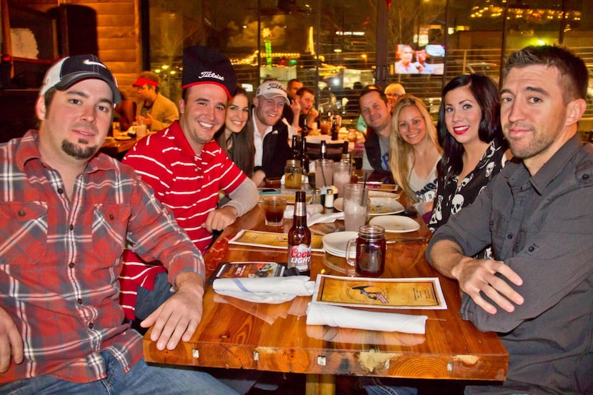 A group of friends hang out at The Nodding Donkey on SMU Boulevard in Dallas in 2012.