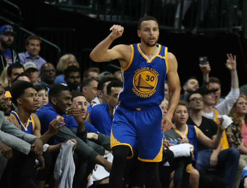 Golden State Warriors guard Stephen Curry (30) gestures after hitting a three-point shot...