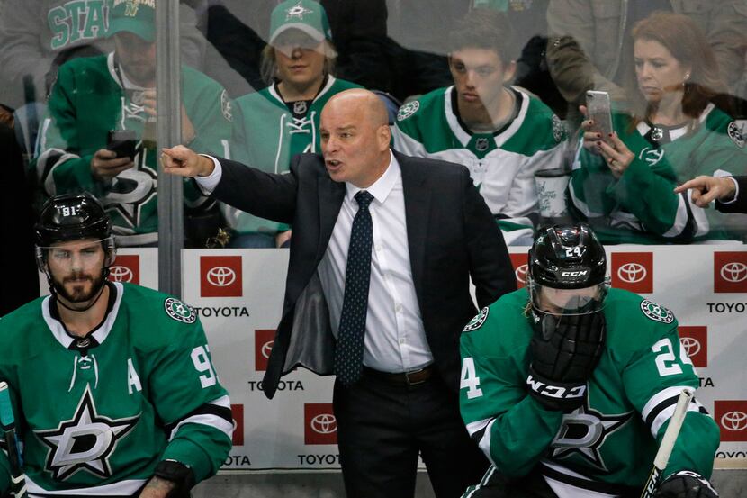FILE - Stars head coach Jim Montgomery coaches his players during the third period of a game...