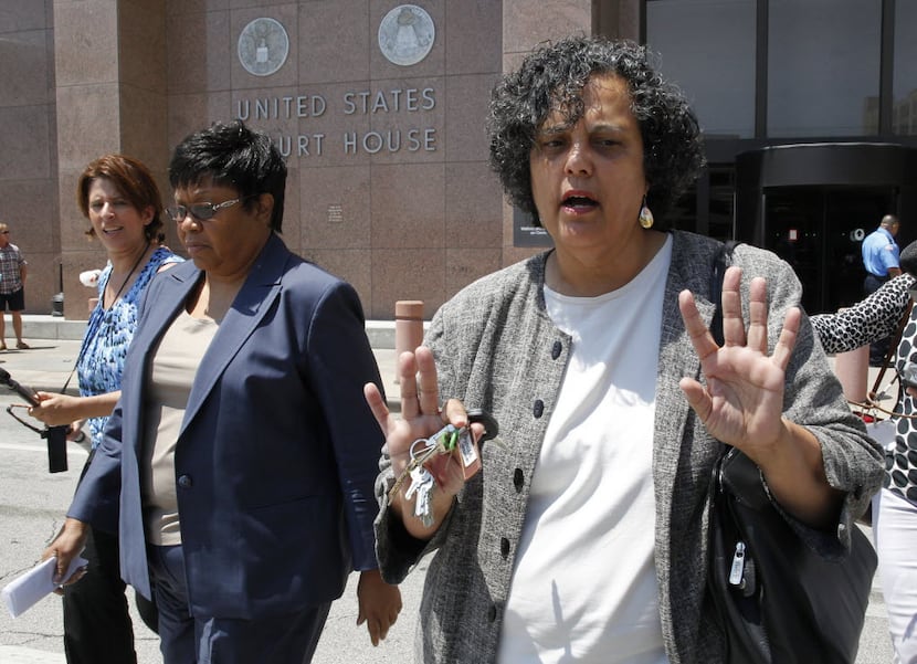 Kathy Nealy (left) leaves the federal courthouse in Dallas in 2014 after being indicted in...