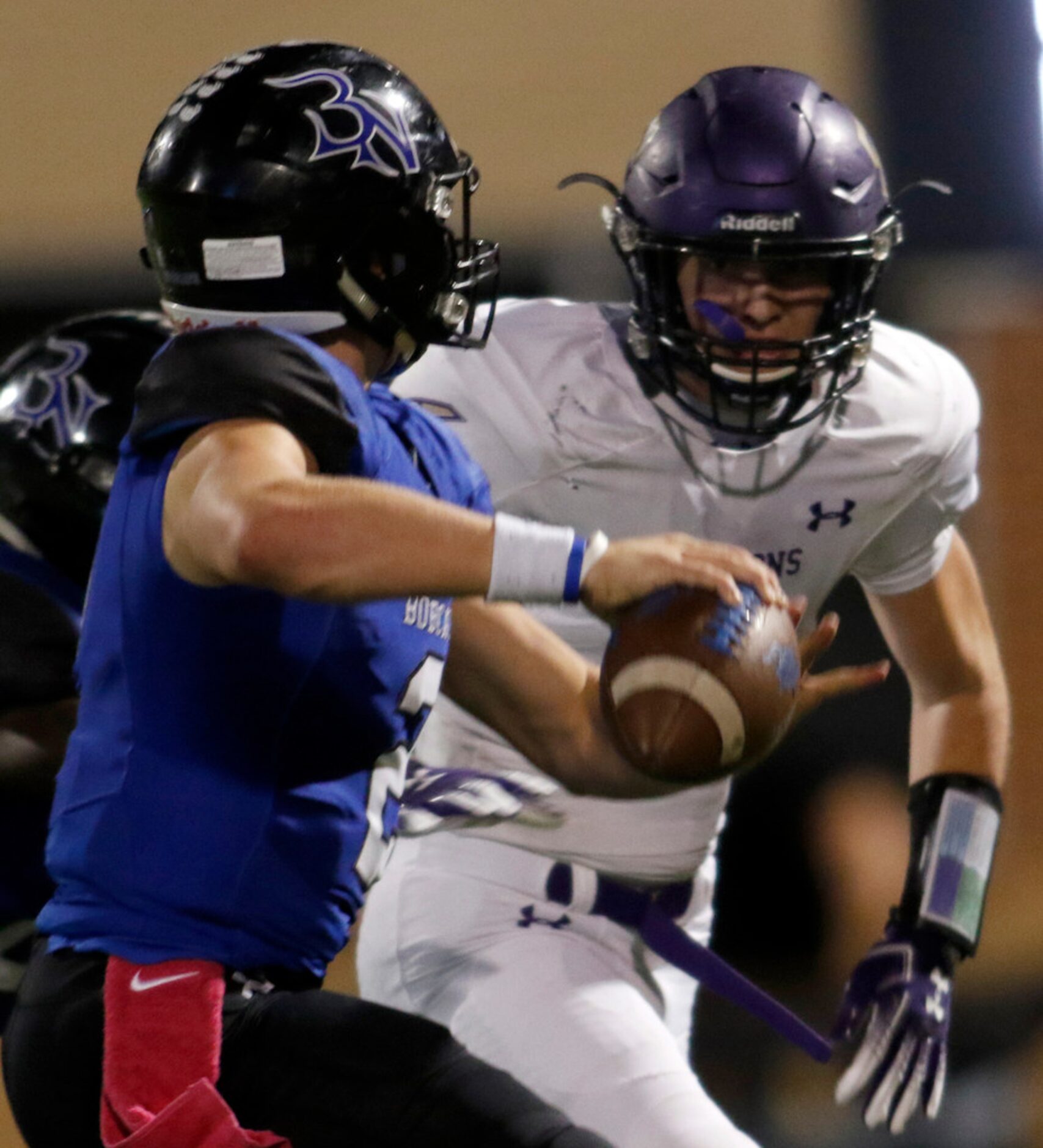 Trophy Club Byron Nelson quarterback Hudson White (2) looks to pass as he faces the "in your...