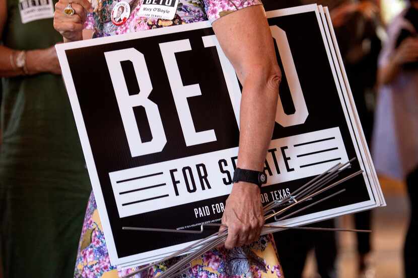 A supporter of Beto O'Rourke, a Democrat looking to unseat incumbent Republican Sen. Ted...