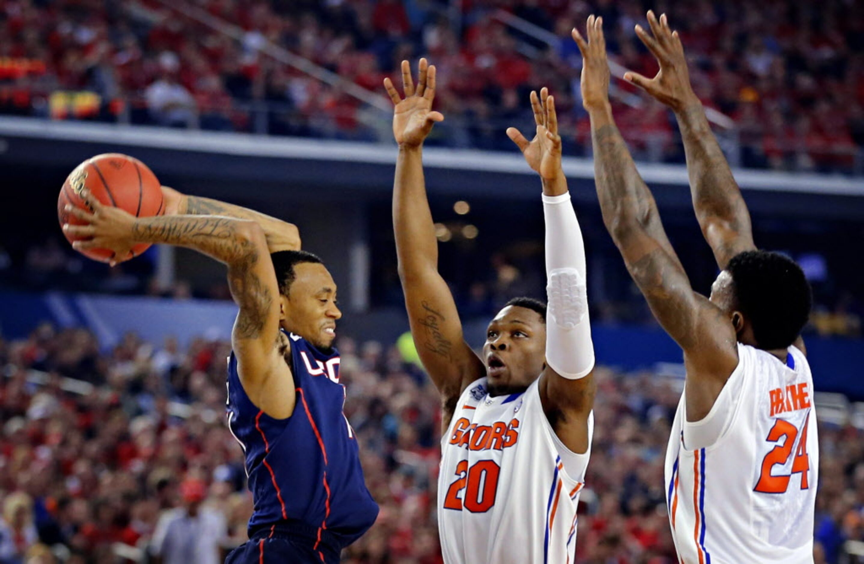 Florida Gators guard Michael Frazier II (20) and forward Casey Prather (24) defend...