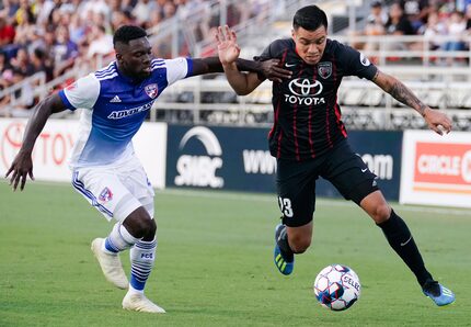 Ema Twumasi of FC Dallas challenges Jose Escalante of San Antonio FC during US Open Cup...