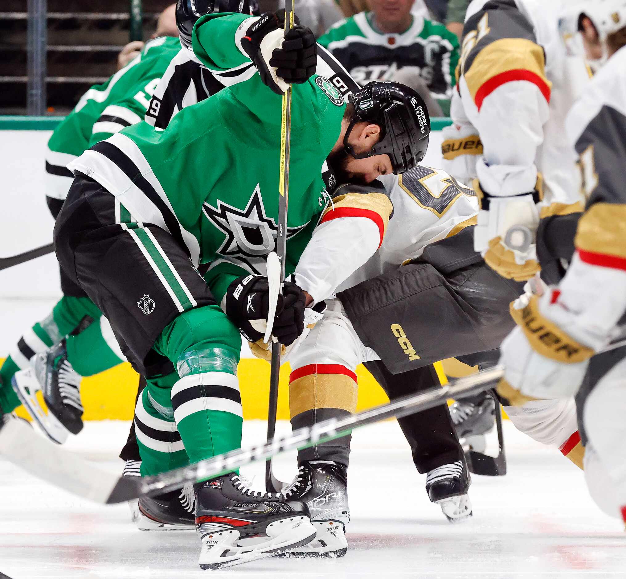 Dallas Stars left wing Jamie Benn (14) smashes into Vegas Golden Knights center Chandler...