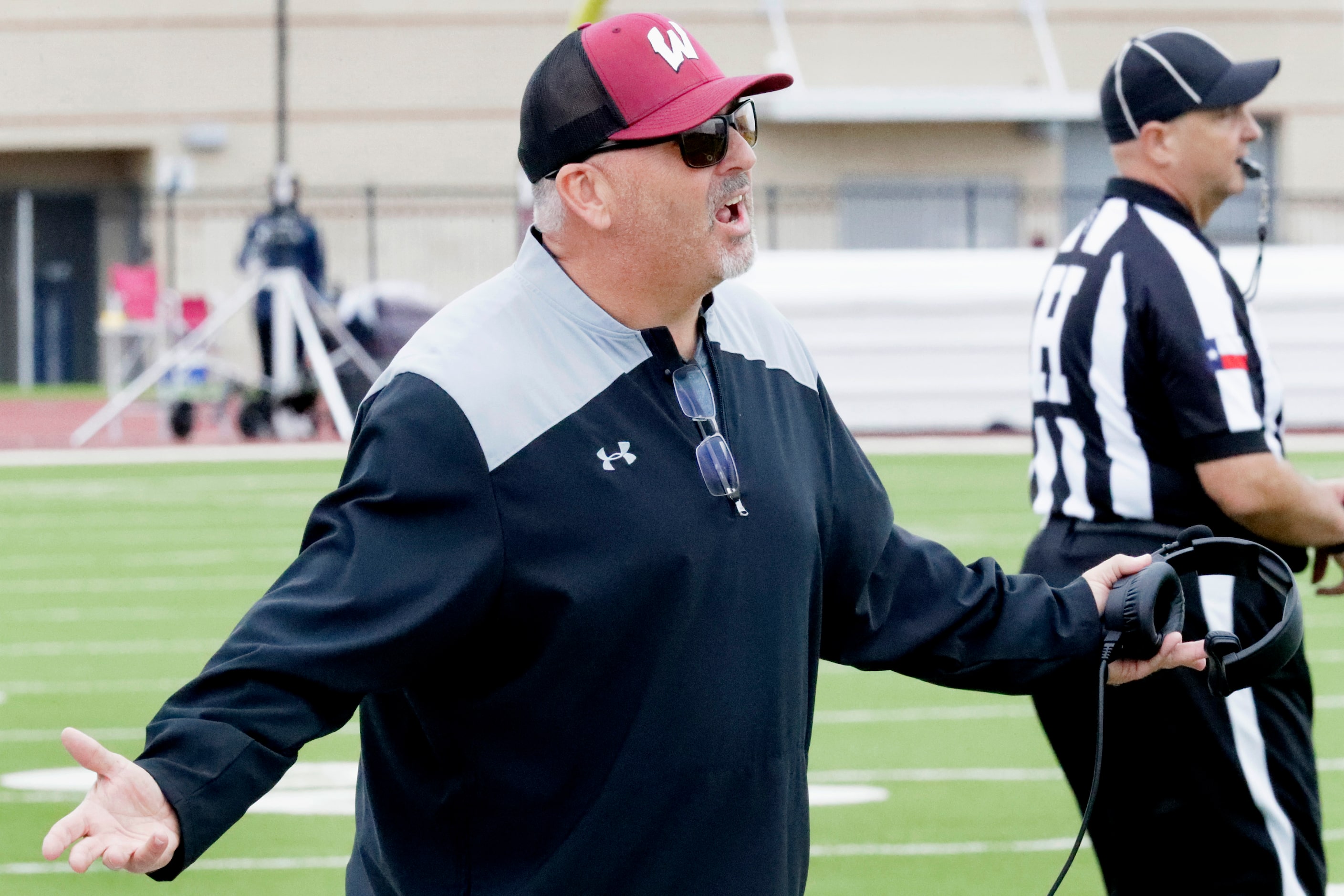 Wylie High School head coach Jimmy Carter questions a call during the first half as Wylie...