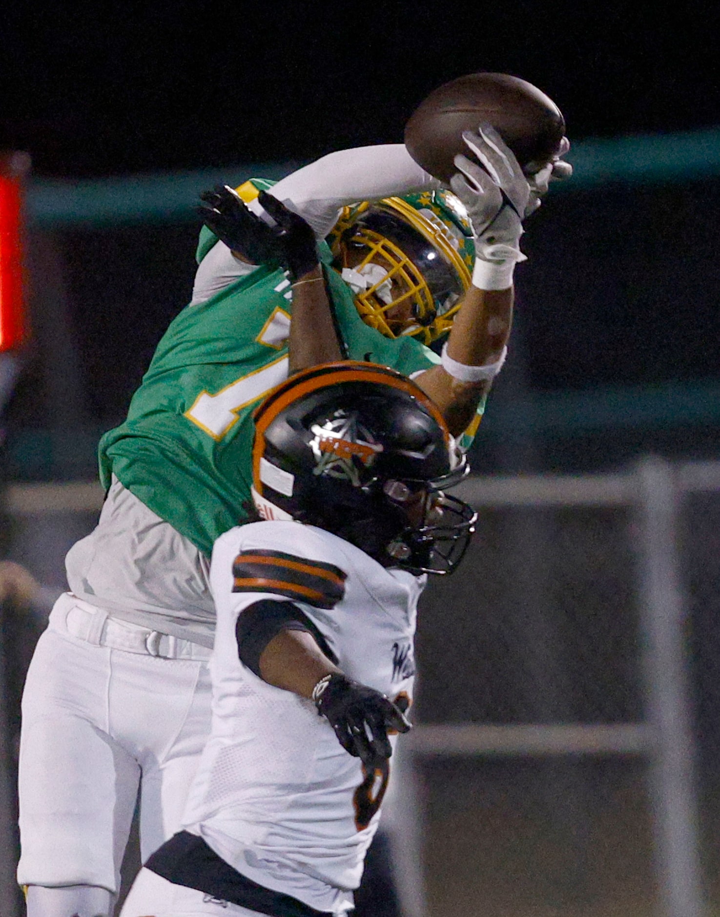 Newman Smith's Allen Burns (7) intercepts a pass intended for West Mesquite's Richard Clark...