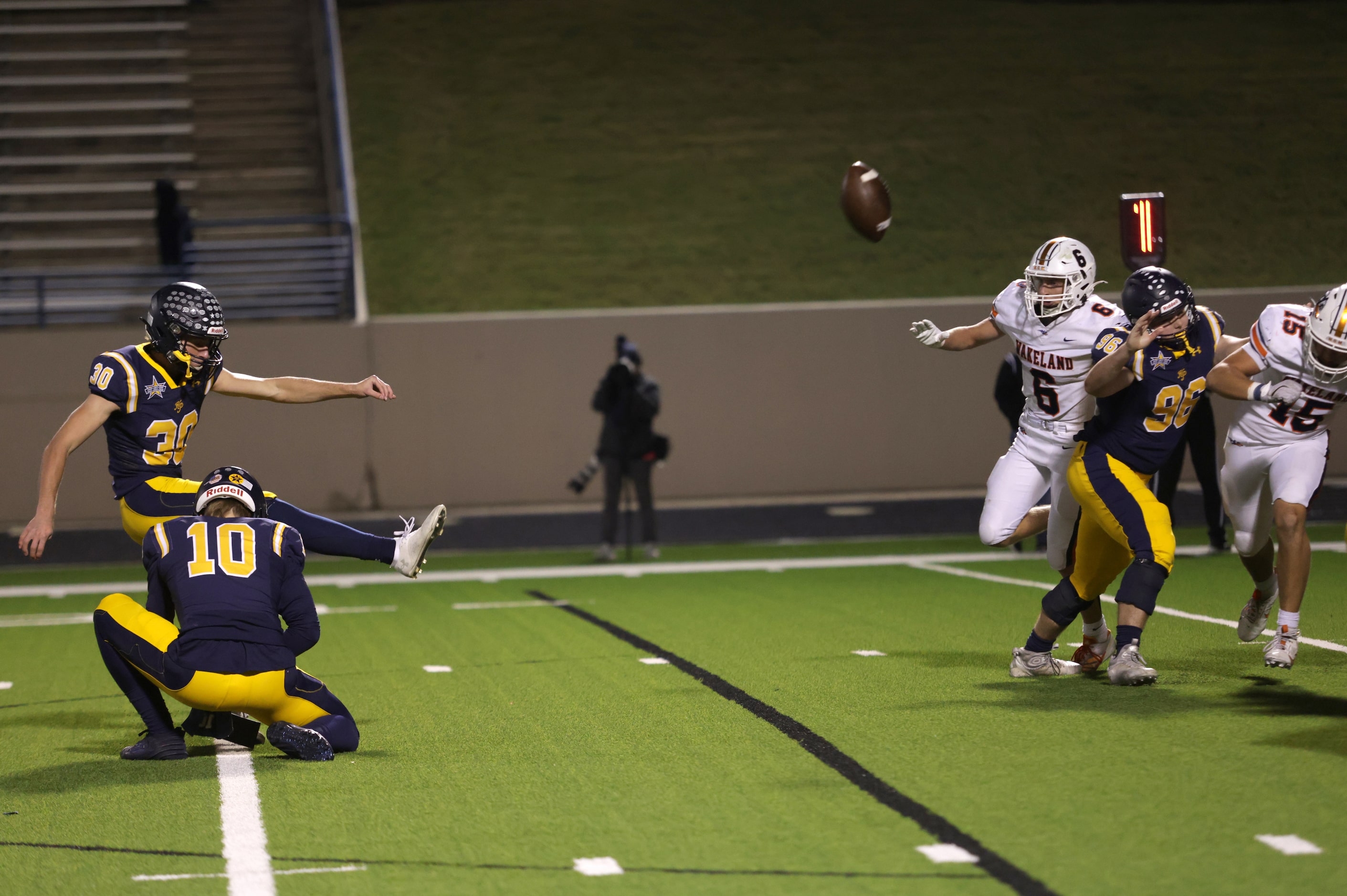 Highland Park's Reece Tiffany kicks a field goal in a football playoff game against Frisco...