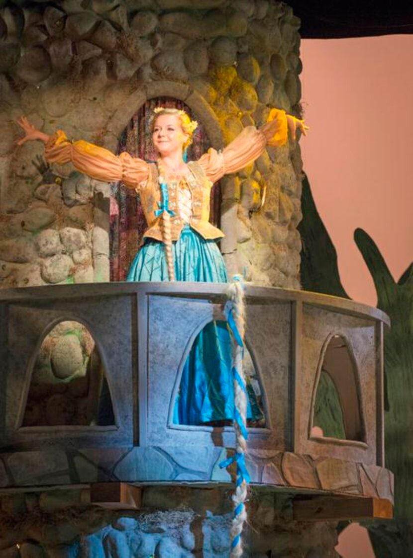 
Erika Larsen in the role of princess Rapunzel sings from her tower during the Dallas...