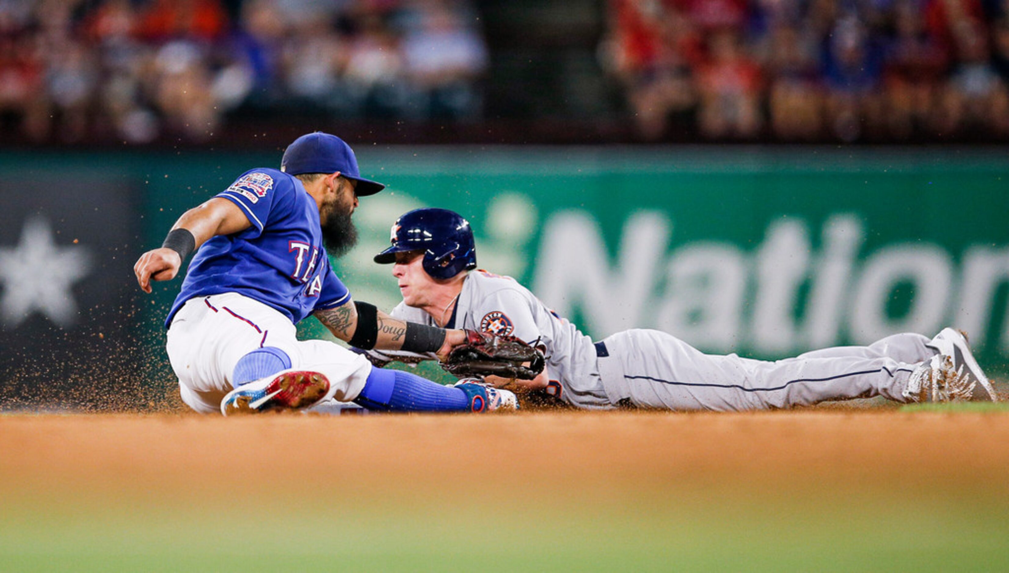 Texas Rangers second baseman Rougned Odor, left, is unable to make the tag as Houston...