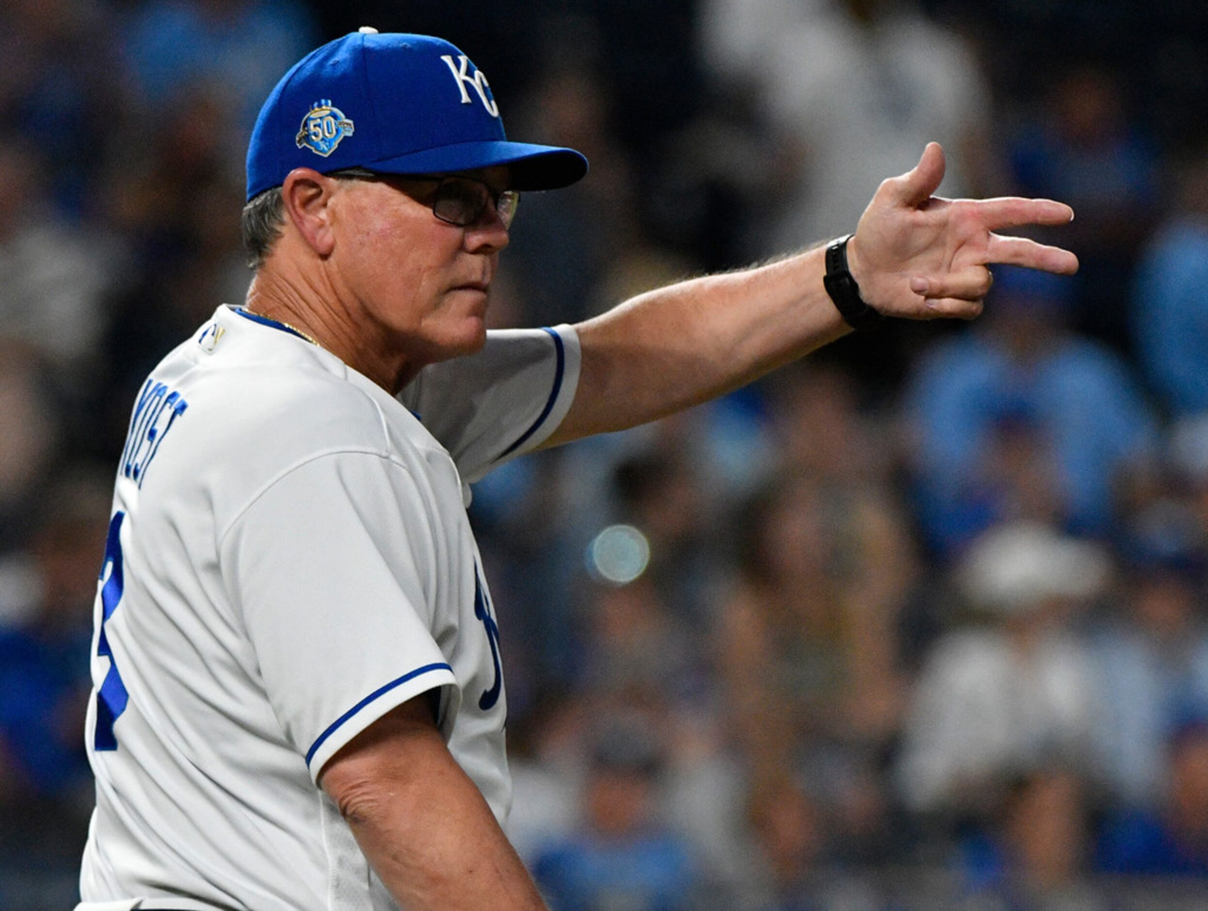 KANSAS CITY, MO - JUNE 19: Ned Yost #3 manager of the Kansas City Royals signals for a...