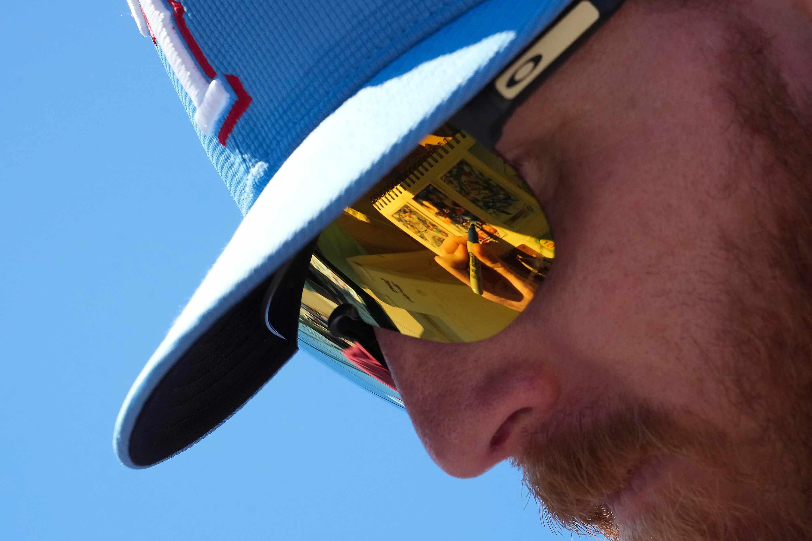 Texas Rangers pitcher Jon Gray signs autographs following a spring training workout at the...