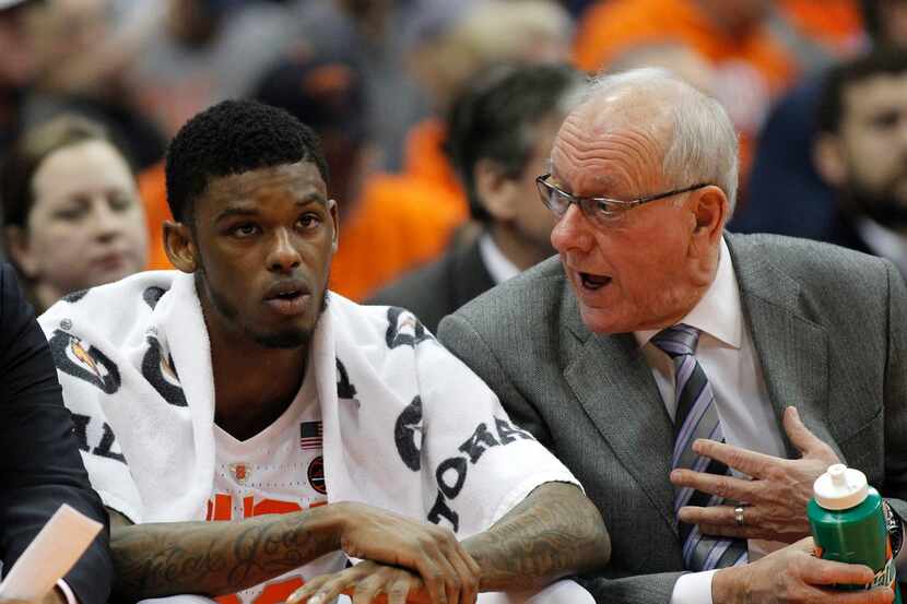 Syracuse head coach Jim Boeheim, right, talks with Syracuse's Frank Howard, left, on the...