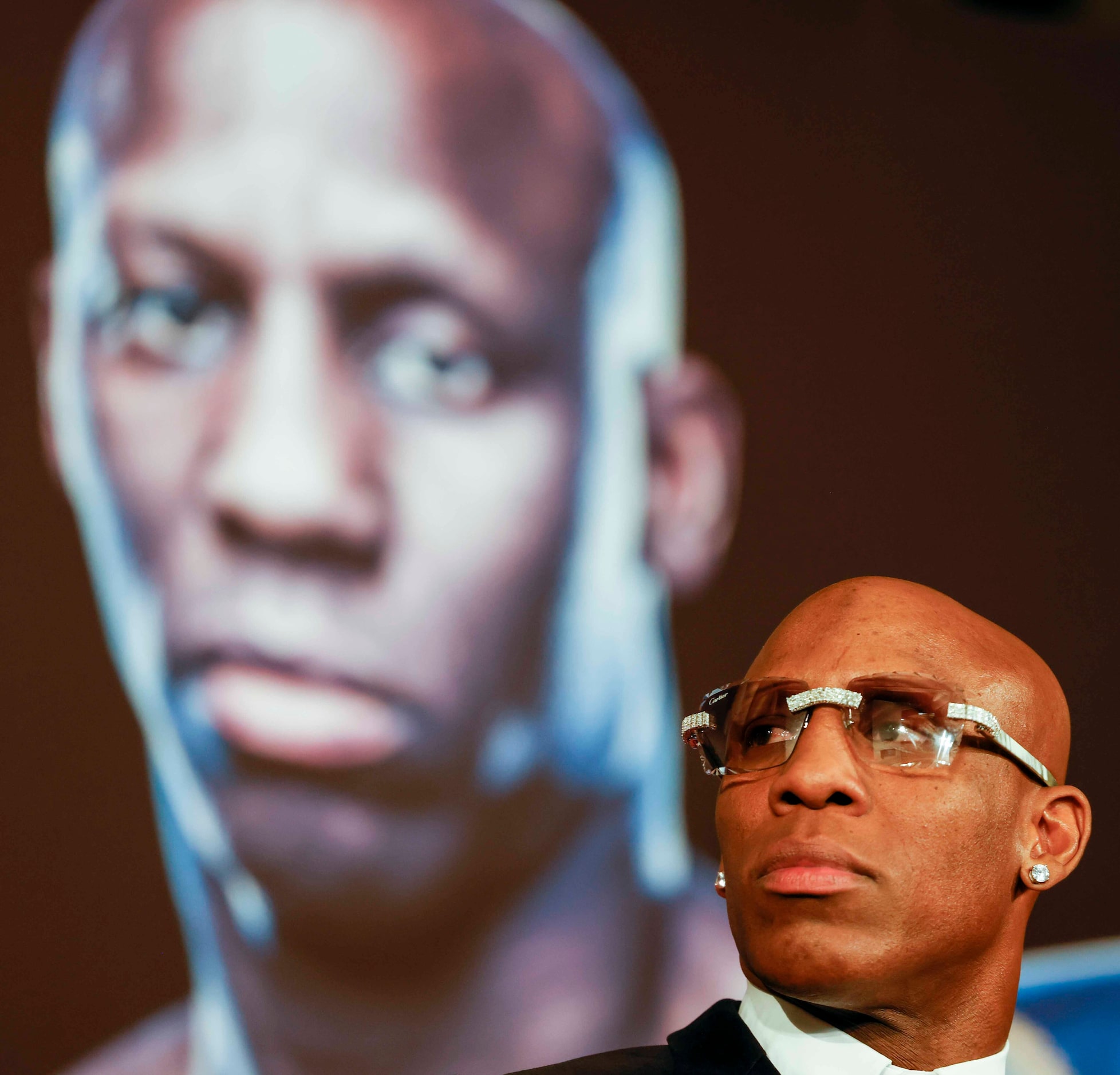 Yordenis Ugas listens during a press conference ahead of his fight this weekend against...