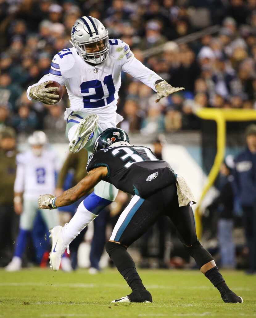 Dallas Cowboys running back Ezekiel Elliott (21) leaps over Philadelphia Eagles defensive...