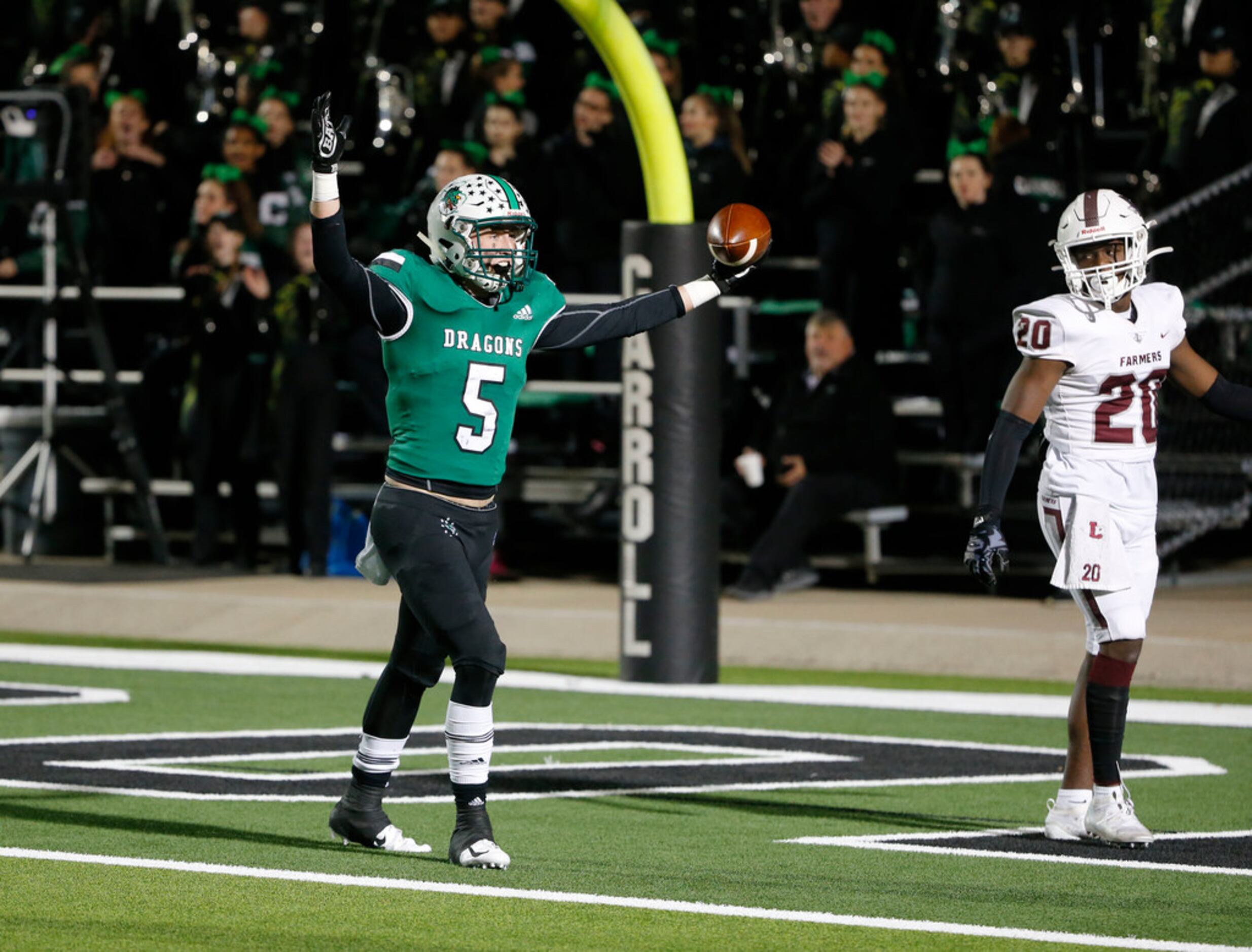 Southlake Carroll's Wills Meyer (5) celebrates his touchdown reception as Lewisville's...