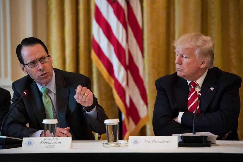 AT&T CEO/president/chairman/Big Kahuna Randall Stephenson (left) with President Donald Trump...