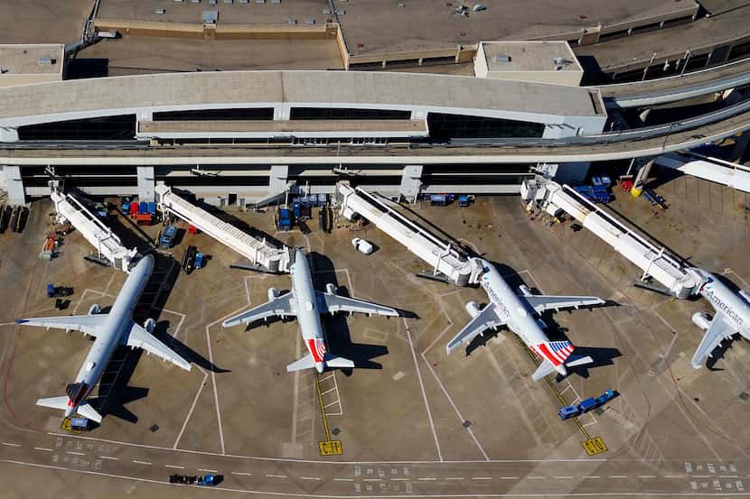 Aerial view of American Airlines aircraft at the gates of Terminal C at Dallas Fort Worth...