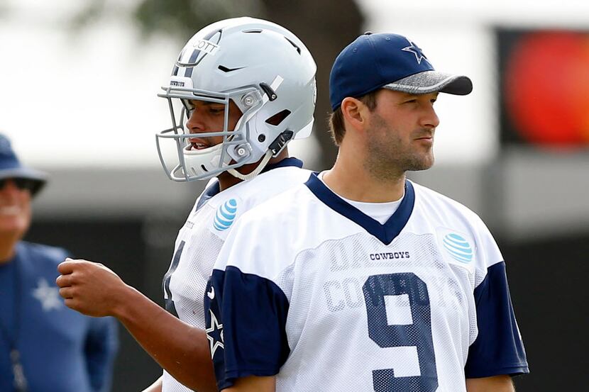 Dallas Cowboys rookie quarterback Dak Prescott (4) and quarterback Tony Romo (9) are...