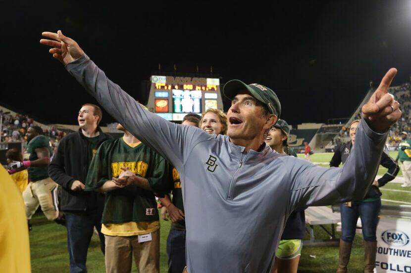 Baylor head football coach Art Briles reacts to their win over Iowa State following an NCAA...