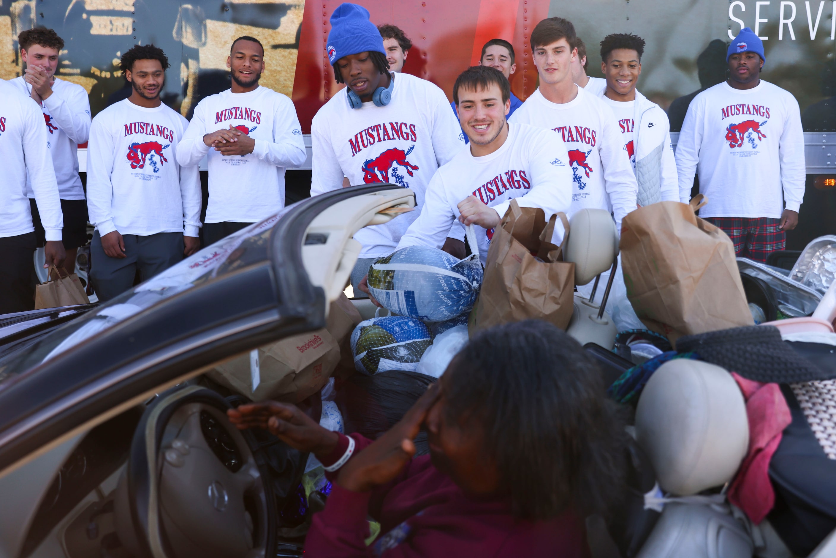 Southern Methodist University’s Tarian Lee Jr. (center left) and Zach Hernandez (center...