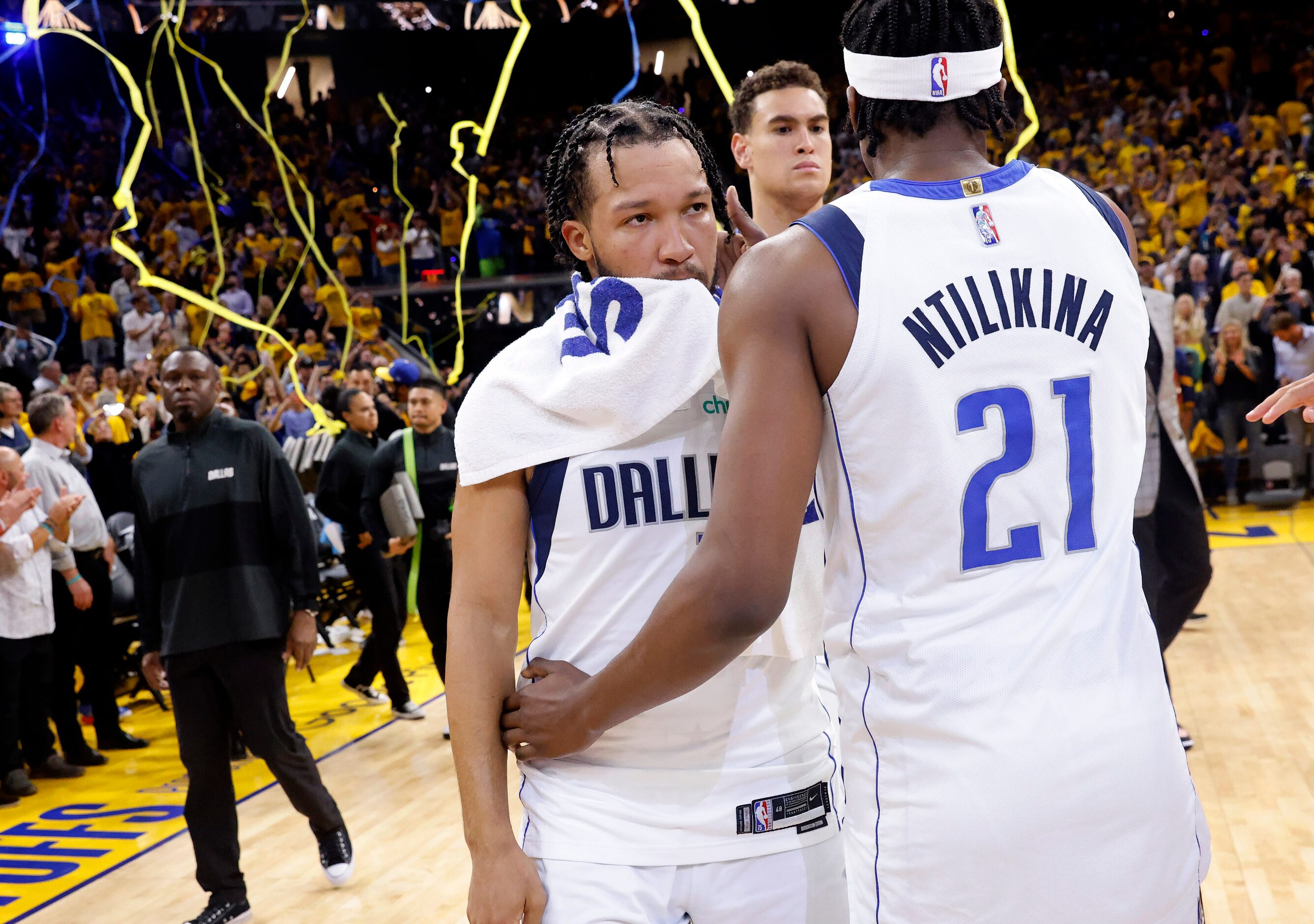 Dallas Mavericks guard Jalen Brunson (13) and Frank Ntilikina (21) hug following their Game...