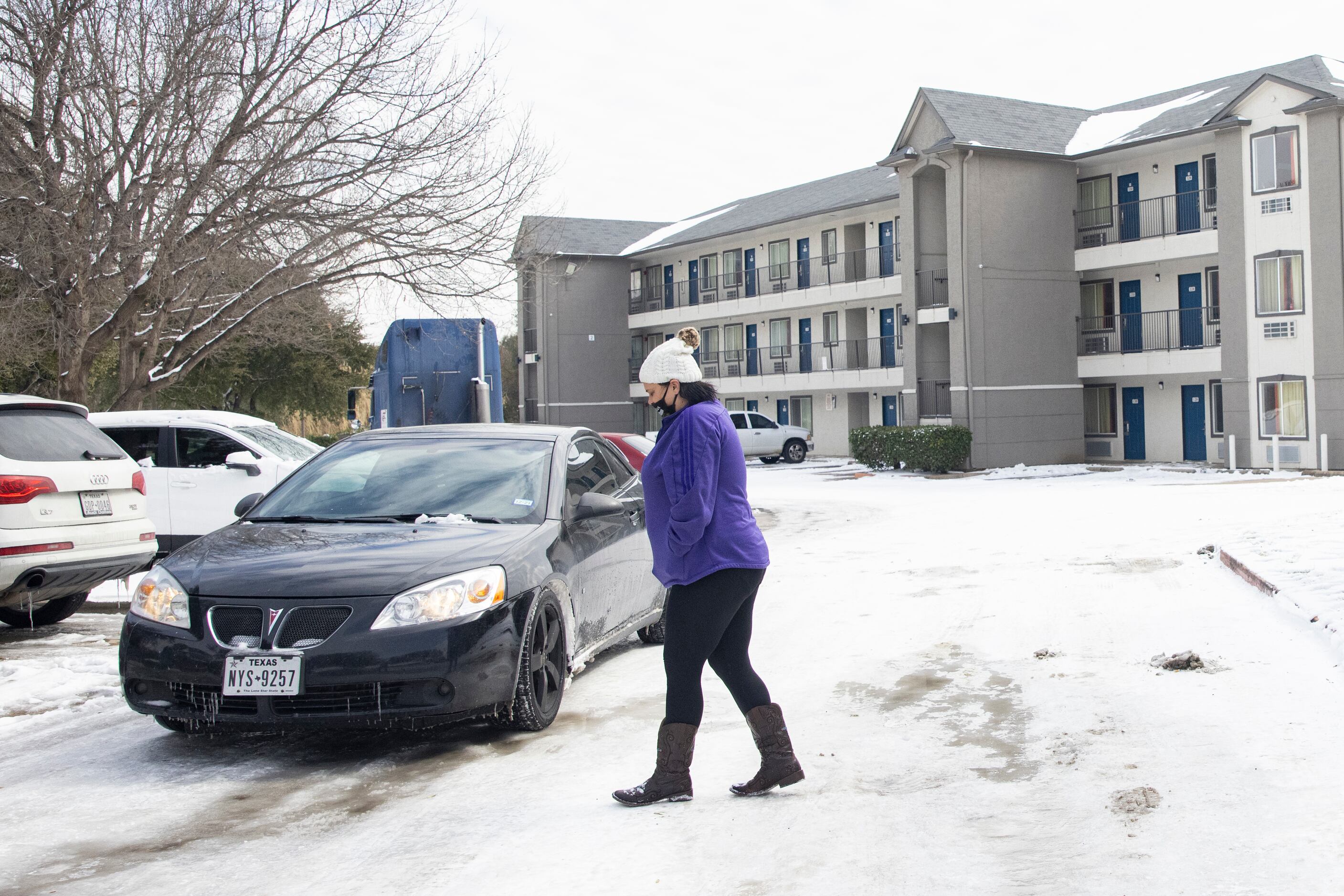 Jammie McGee from Dallas walks back to her car after finding out the Motel 6 in North...