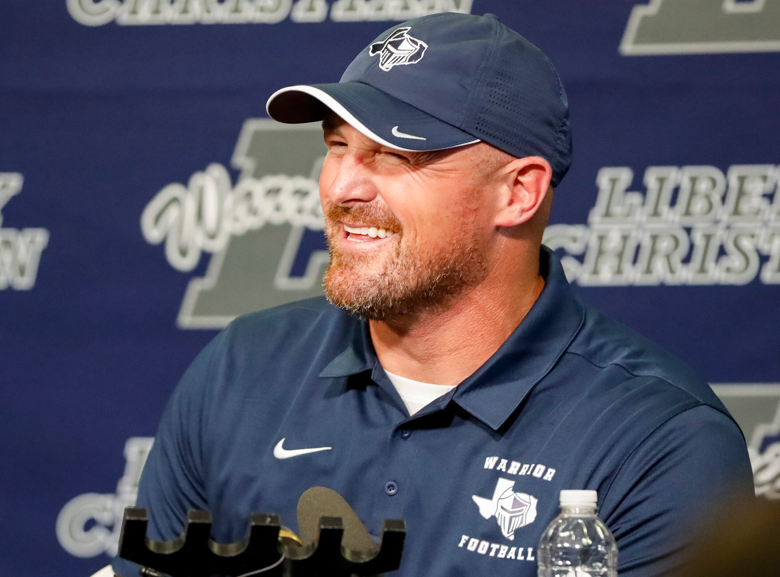 Argyle Liberty Christian head coach Jason Witten laughs during a press conference on Friday,...