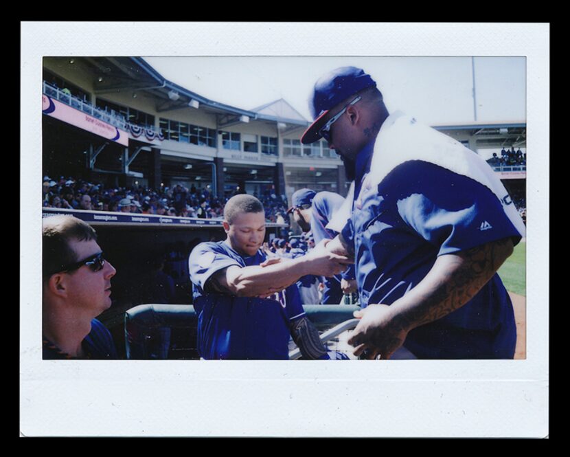  Texas Rangers spring training 2015: Texas Rangers outfielder Michael Choice (center) greets...