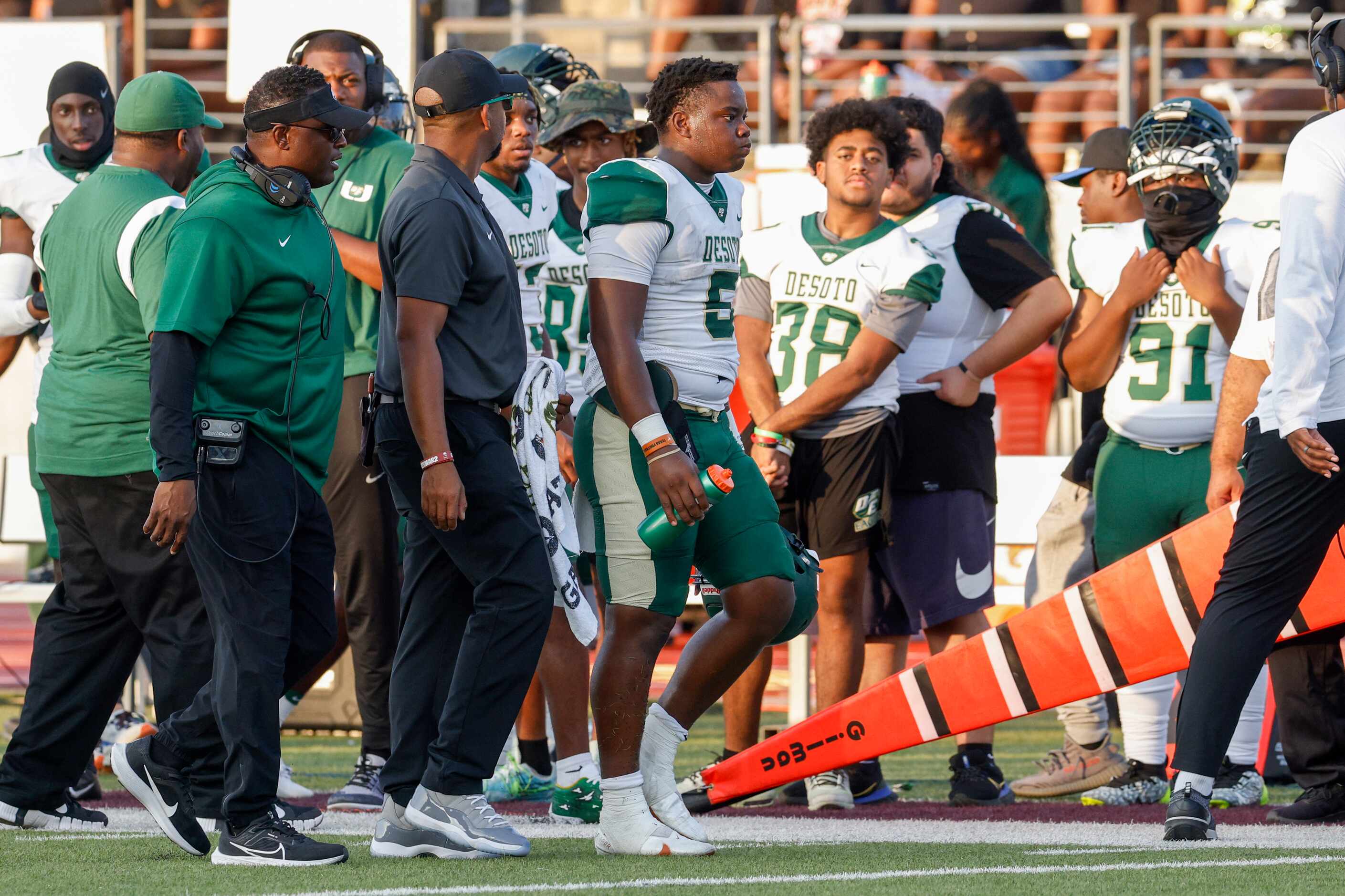 DeSoto quarterback Darius Bailey (5) heads to the locker room after suffering an apparent...