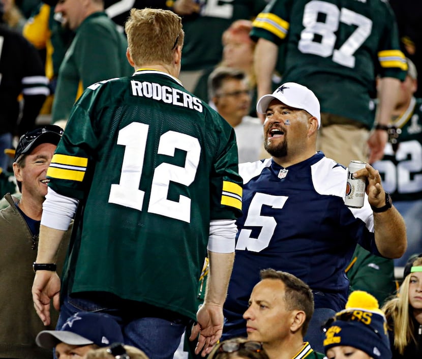 A Dallas Cowboys fan heckles a Green Bay Packers fan during the second half of Dallas' 30-16...