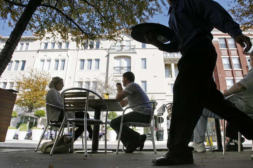  Residents of Uptown and the West Village enjoy a sun-splashed afternoon on the patio of Mi...