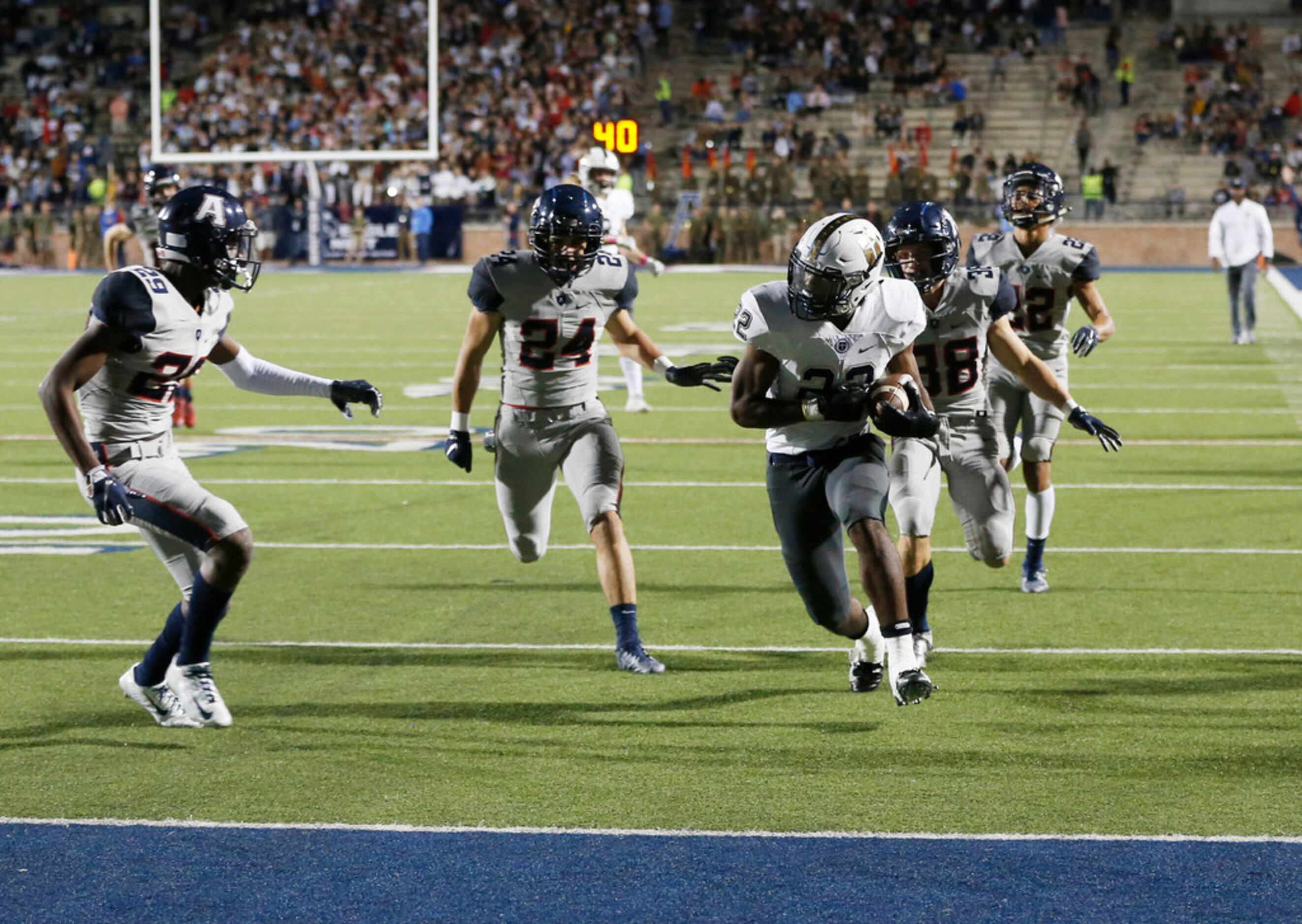 Jesuit's EJ Smith (22) runs for a touchdown as Allen's Kris Collins (29), Link Smith (24)...