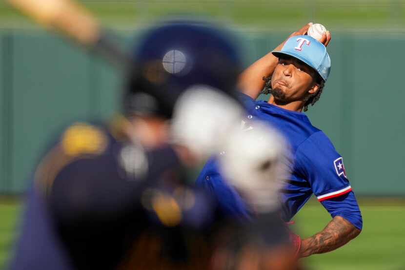 Texas Rangers pitcher Marc Church delivers during the ninth inning of a spring training game...