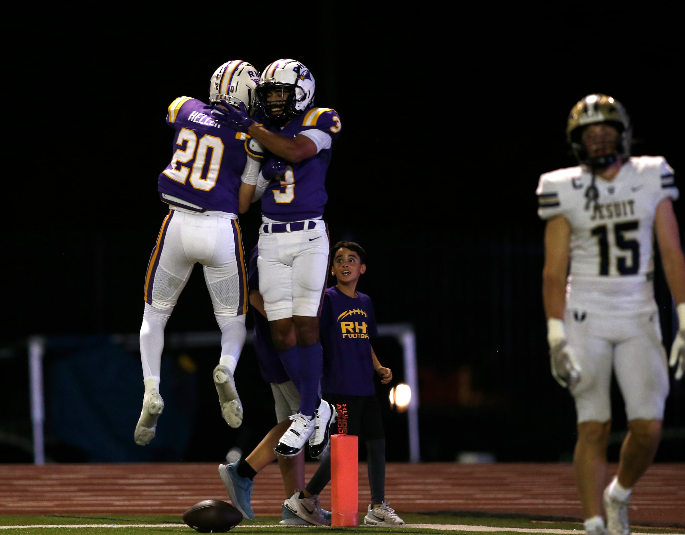 Richardson wide receiver Evan Tabora (3) and h-back Michael Heller (20) celebrate as Jesuit...