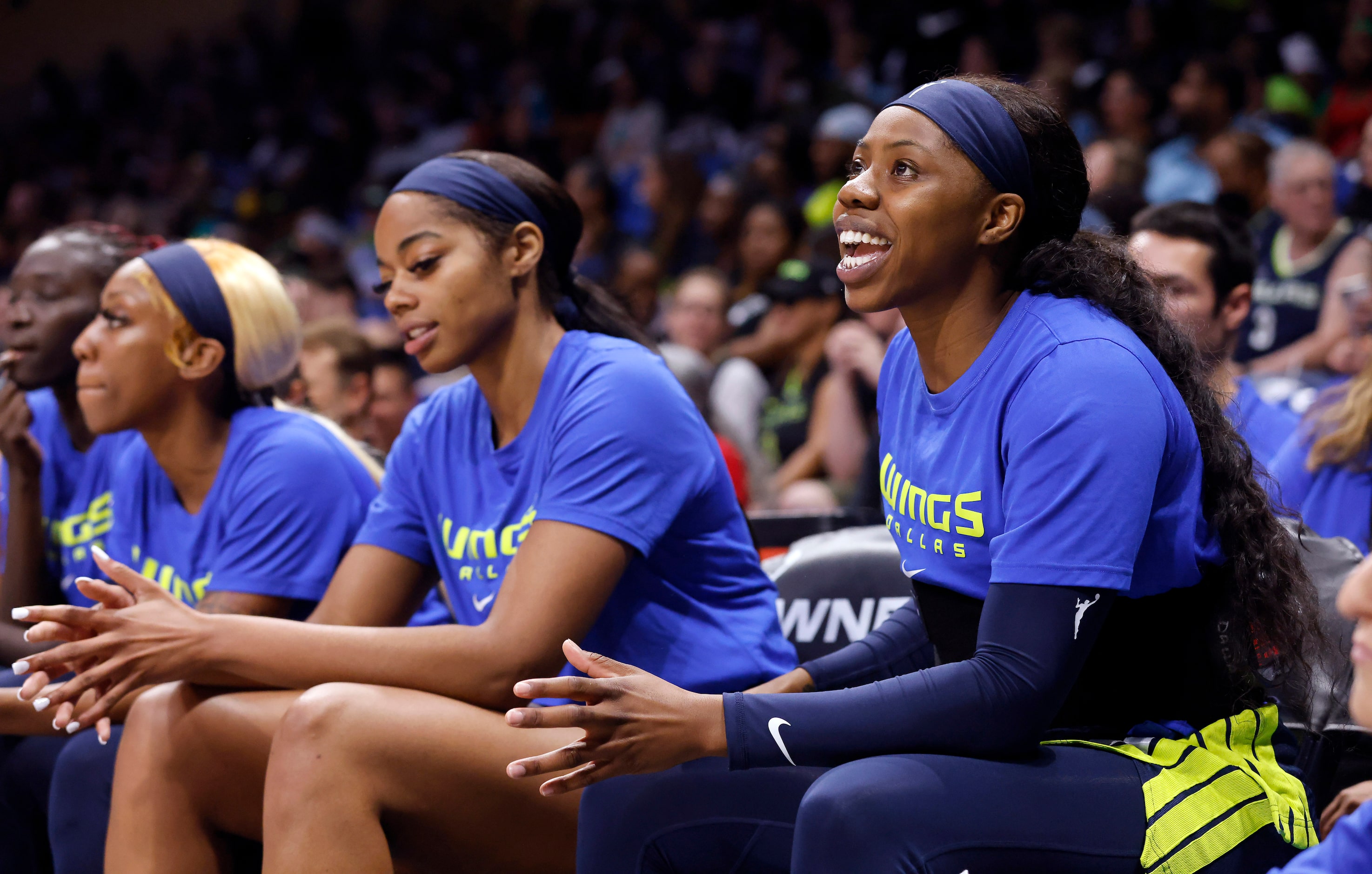 Dallas Wings guard Arike Ogunbowale watches her teammates compete against the Connecticut...