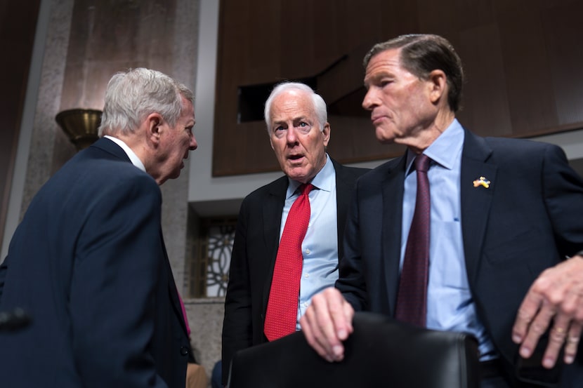 Sen. John Cornyn, R-Texas, center, is flanked by Senate Judiciary Committee Chairman Dick...