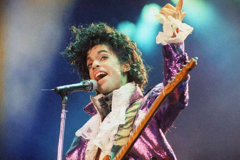In this Feb. 18, 1985 file photo, Prince performs at the Forum in Inglewood, Calif. Prince,...