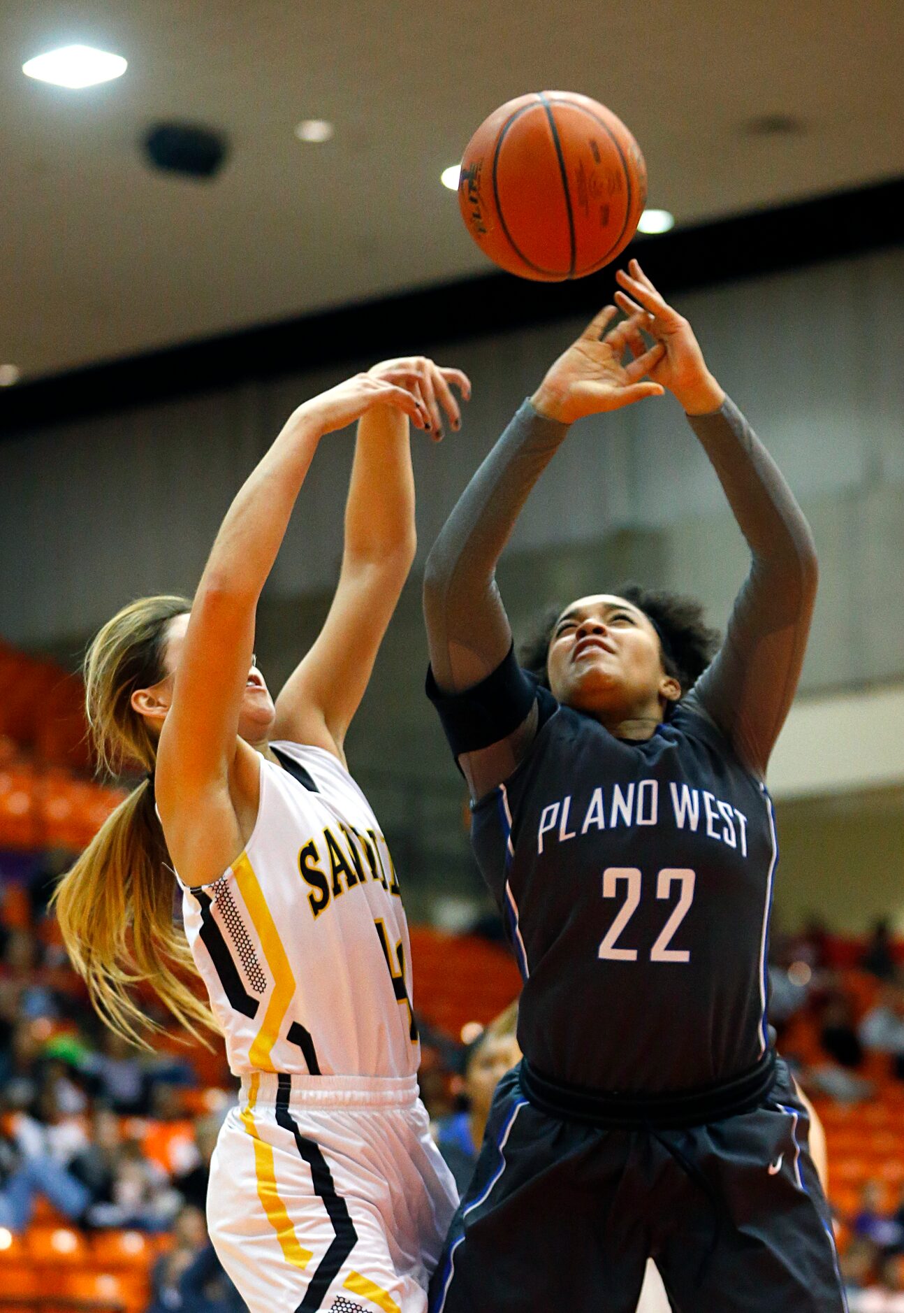 Plano West guard Jalyn Hodge (22) goes up for the ball with Amarillo guard Lexy Hightower...