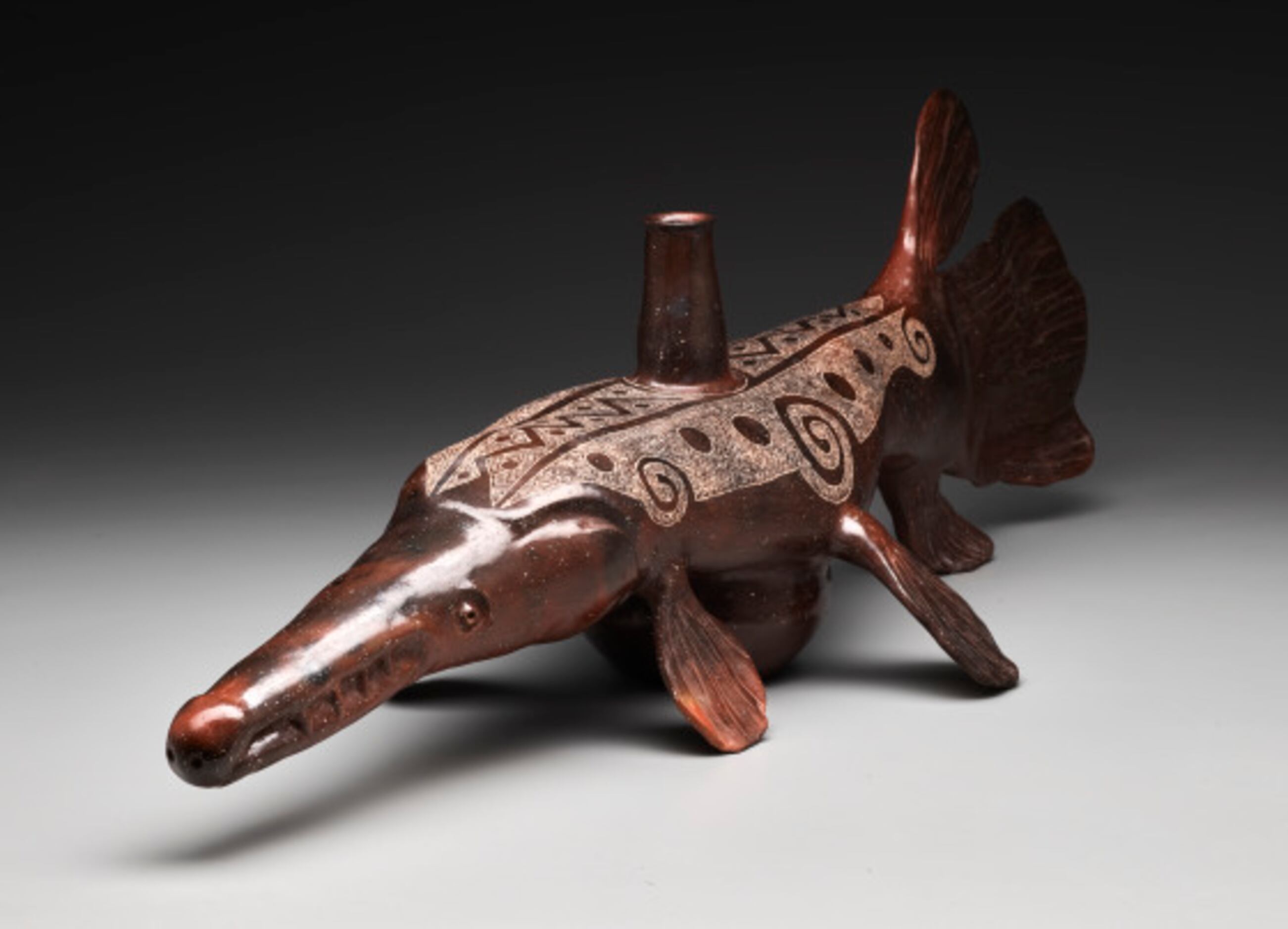 A batah kuhuh alligator gar fish effigy bottle, a contemporary Native American piece, is...