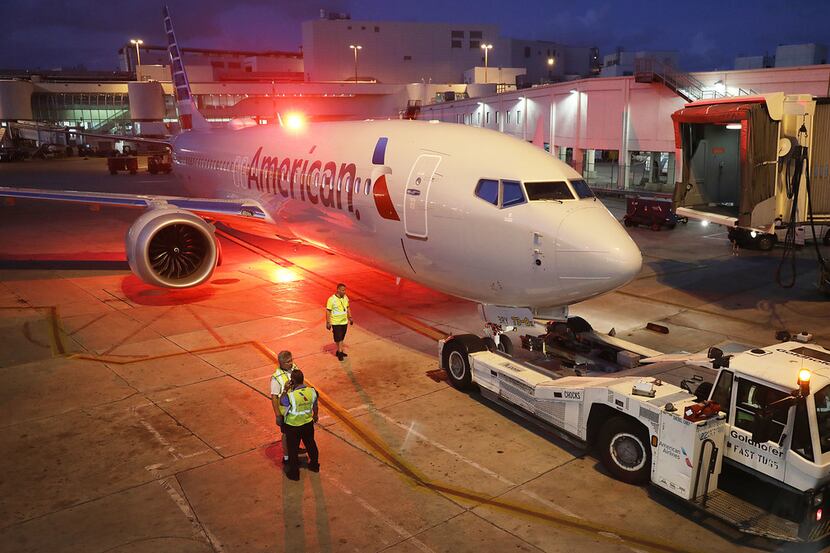 MIAMI, FL - MARCH 13: A grounded American Airlines Boeing 737 Max 8 is towed to another...