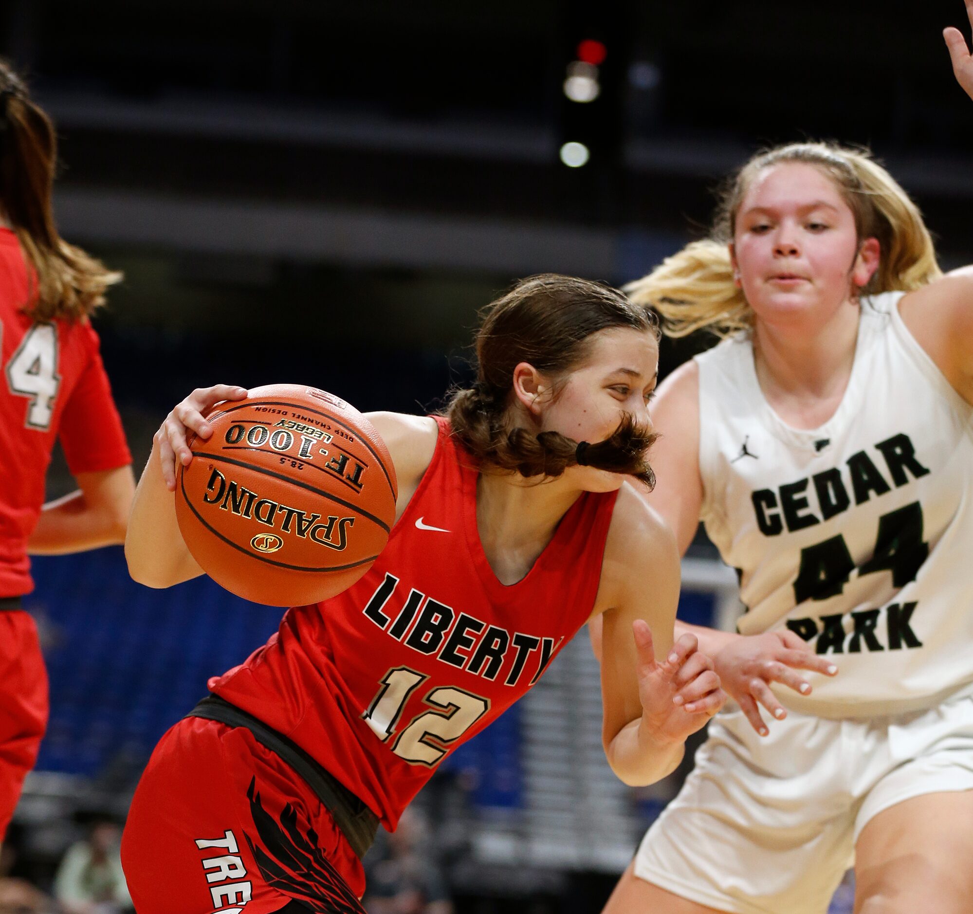 Frisco Liberty Ashley Anderson #12 drives on Cedar Park Shelby Hayes #44. Frisco Liberty vs....